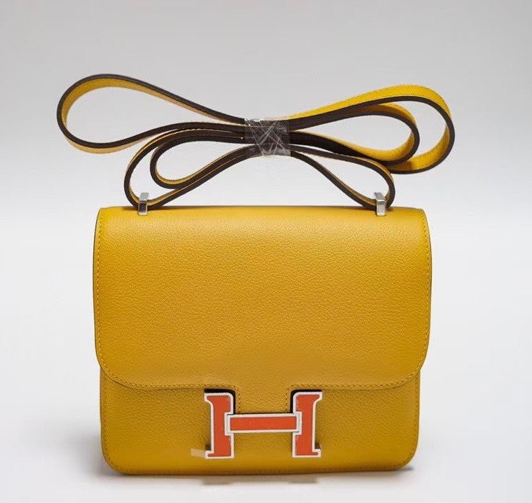 Hermes Jaune d'or Constance Epsom leather 18cm With Enamel Hardware