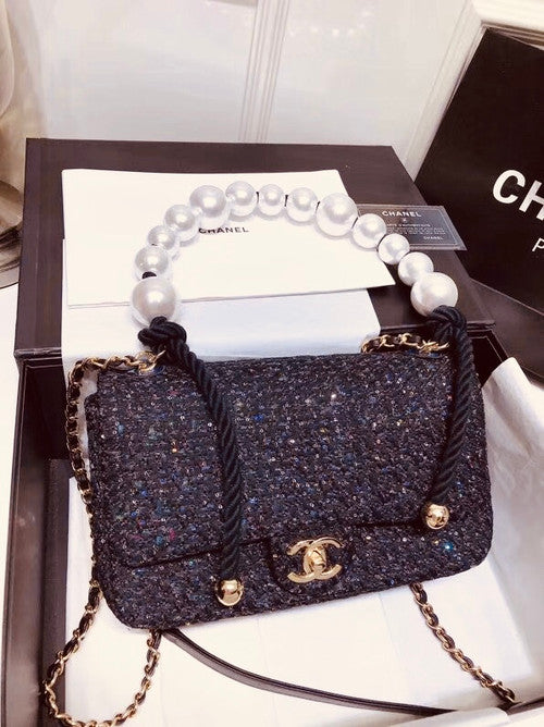 Chanel Pearl flap bag in black tweed