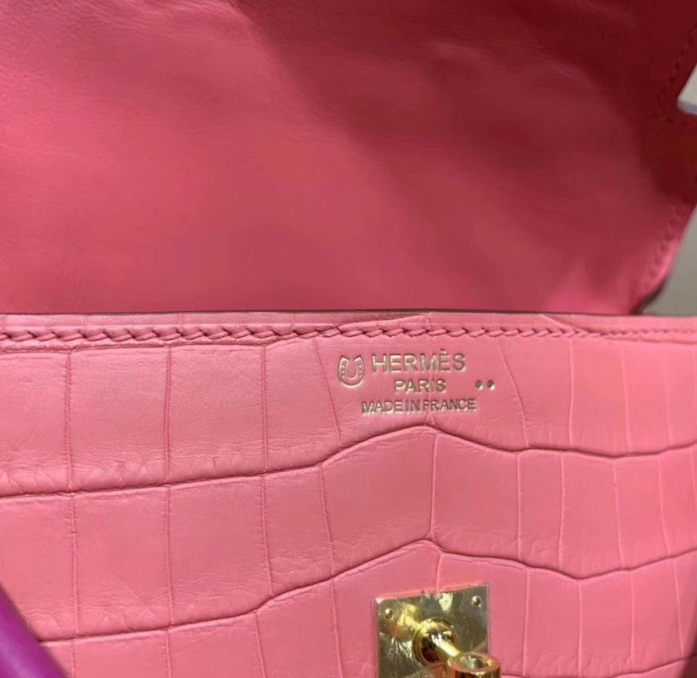 Hermes Kelly Idole (Kelly Doll) in Pink Sakura  Nilo crocodile with Palladium hardware.
