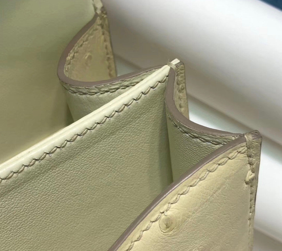 HERMÈS Constance 24 Wool White Ostrich with Gold Hardware