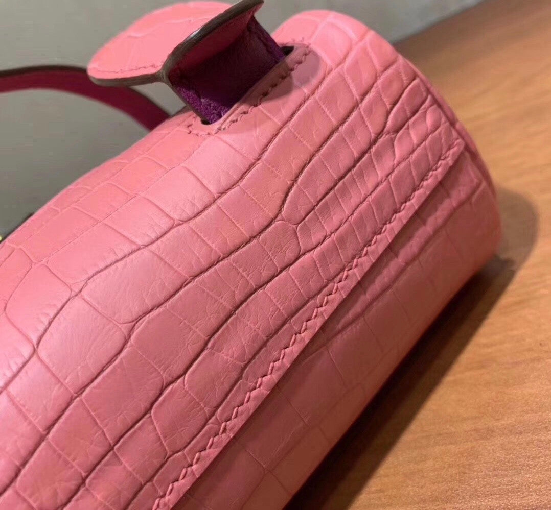 Hermes Kelly Idole (Kelly Doll) in Pink Sakura  Nilo crocodile with Palladium hardware.