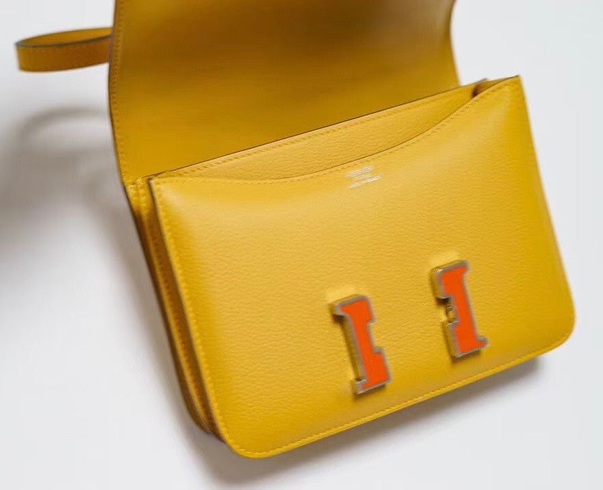 Hermes Jaune d'or Constance Epsom leather 18cm With Enamel Hardware