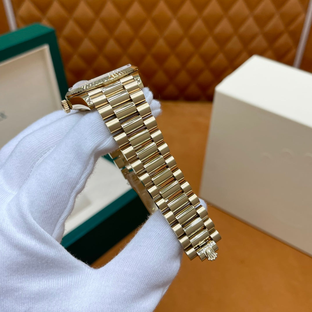 ROLEX DAY-DATE 36 18k Yellow Gold | White Mother-of-Pearl Baguette Dial | President Bracelet