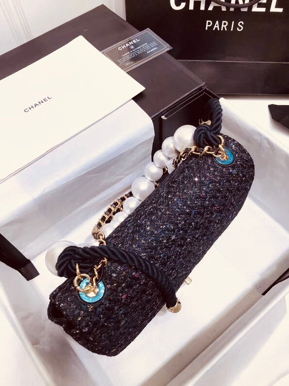 Chanel Pearl flap bag in black tweed