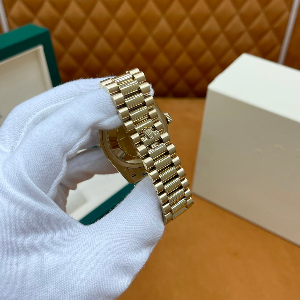 ROLEX DAY-DATE 36 18k Yellow Gold | White Mother-of-Pearl Baguette Dial | President Bracelet