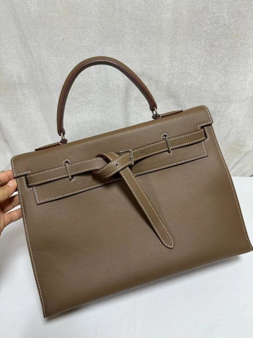 Hermes  A PARCHEMIN SWIFT LEATHER  ETOUPE KELLY FLAT 35 BAG