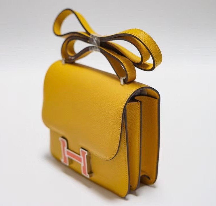 Hermes Jaune d'or Constance Epsom leather 18cm With Enamel Hardware