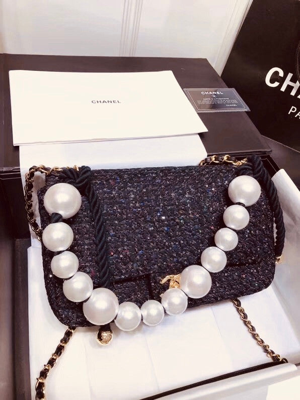 Chanel Pearl flap bag in black tweed