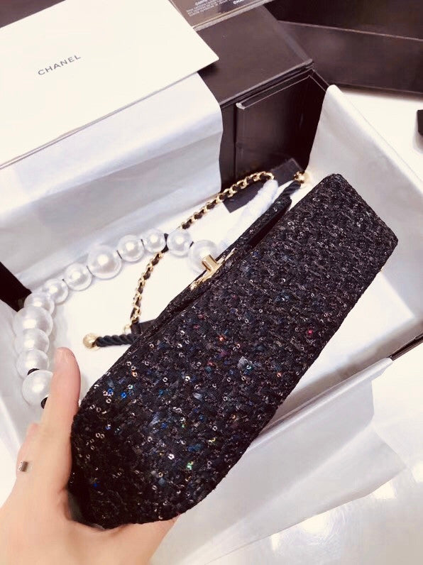 Chanel Pearl flap bag in black tweed