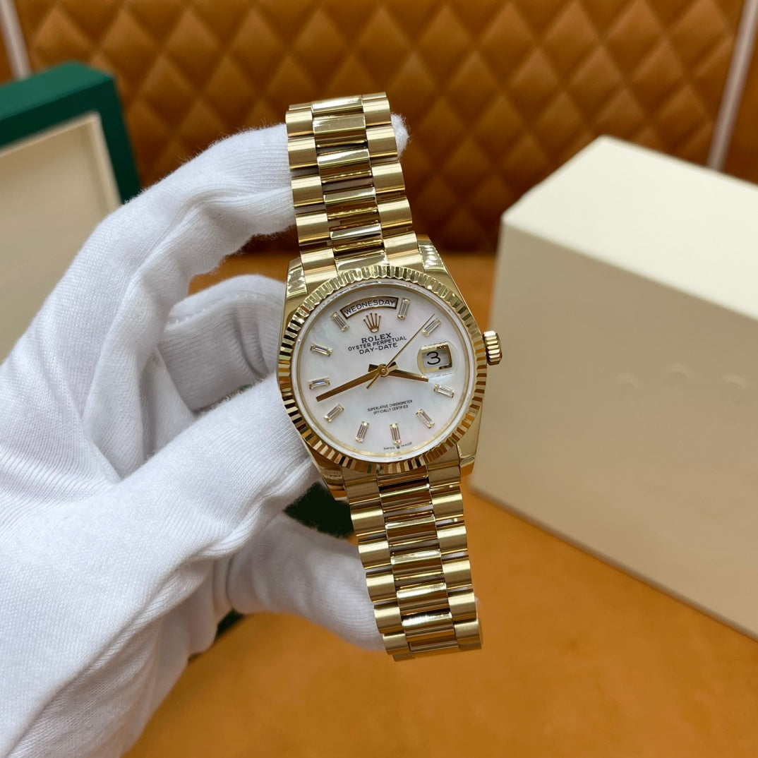 ROLEX DAY-DATE 36 18k Yellow Gold | White Mother-of-Pearl Baguette Dial | President Bracelet