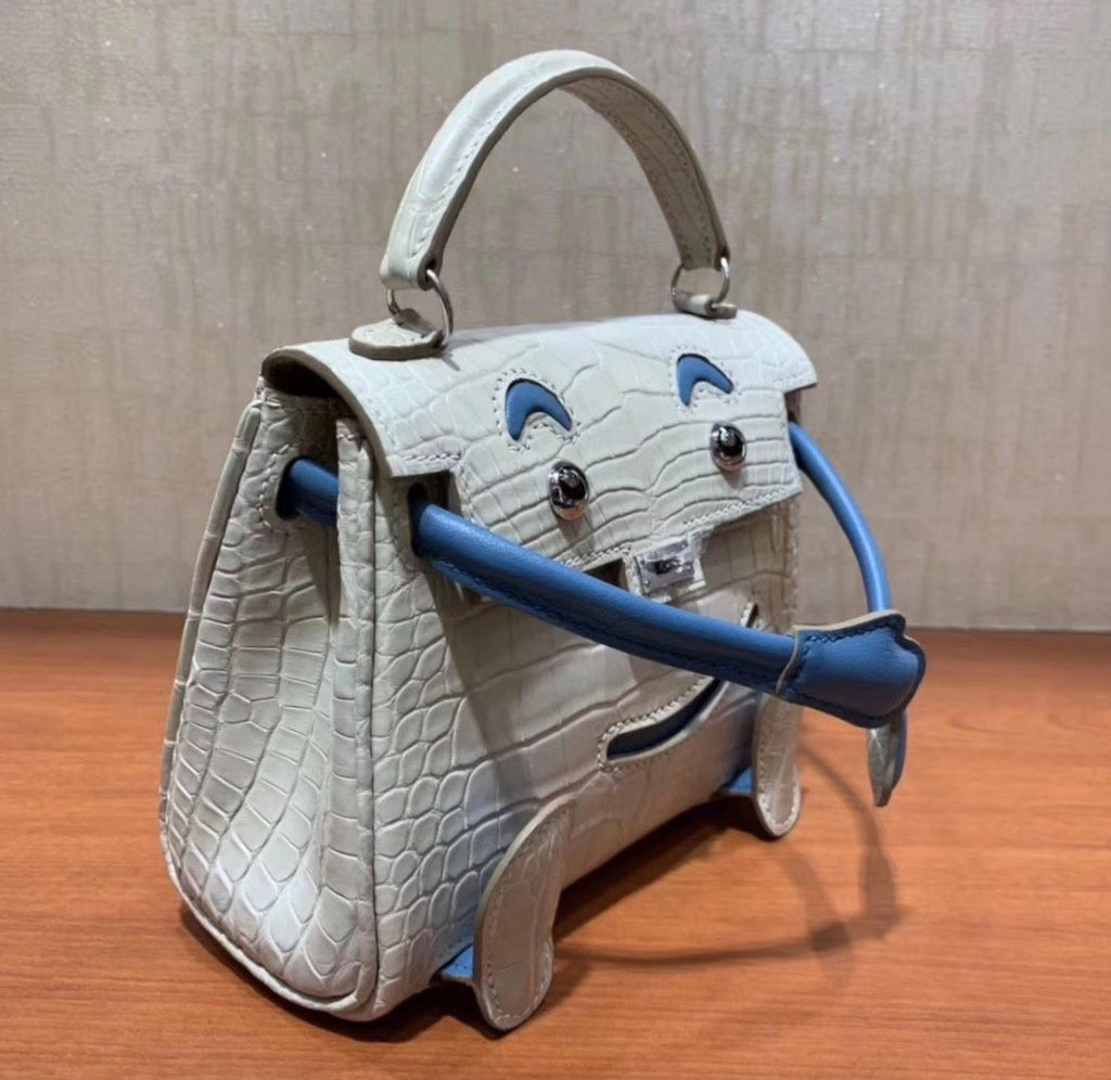 Hermes Kelly Idole (Kelly Doll) in GRIS PERLE Alligator with Palladium hardware.