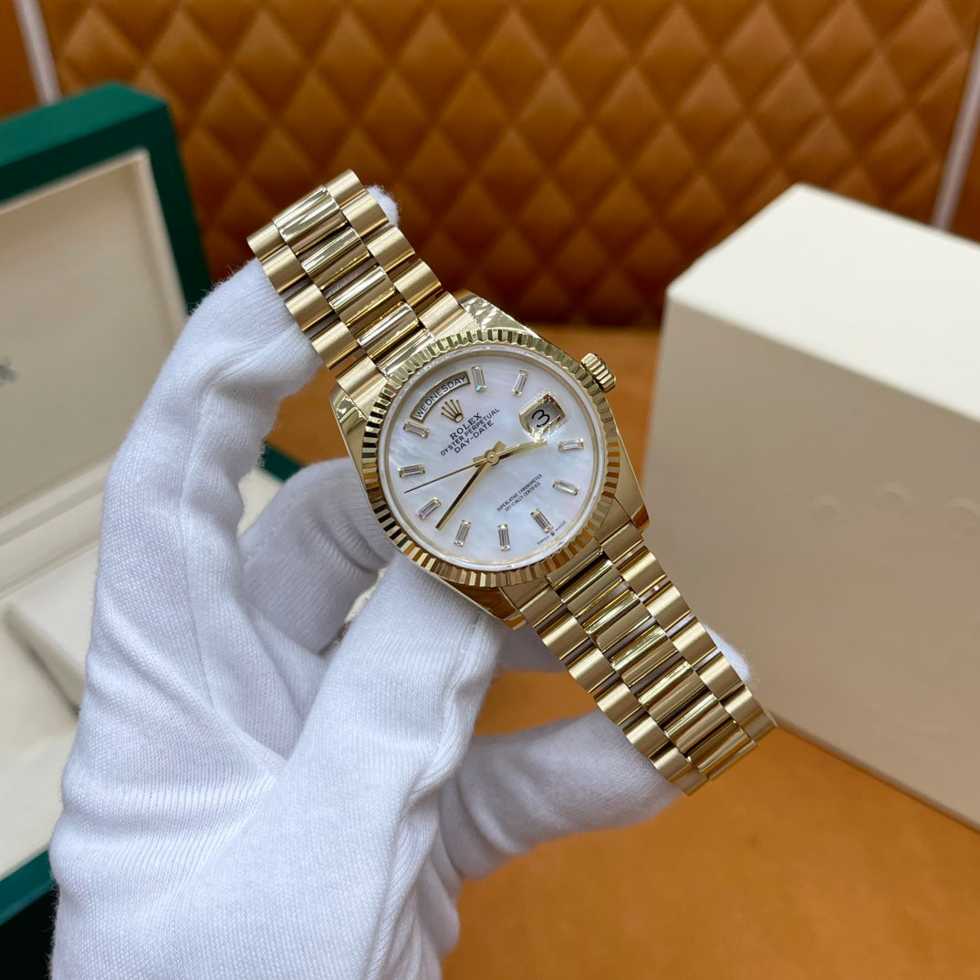 ROLEX DAY-DATE 36 18k Yellow Gold | White Mother-of-Pearl Baguette Dial | President Bracelet