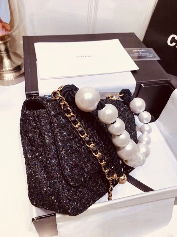Chanel Pearl flap bag in black tweed