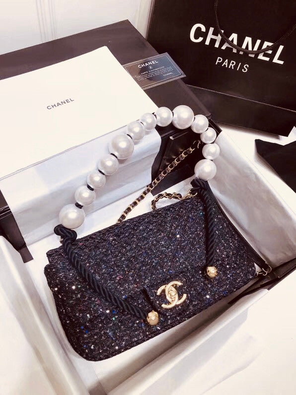 Chanel Pearl flap bag in black tweed