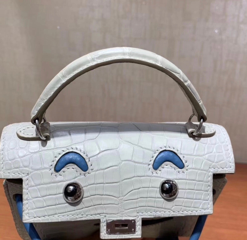 Hermes Kelly Idole (Kelly Doll) in GRIS PERLE Alligator with Palladium hardware.
