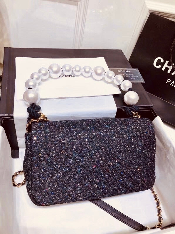 Chanel Pearl flap bag in black tweed