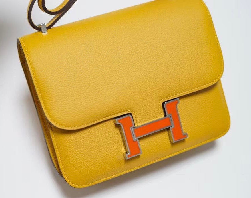 Hermes Jaune d'or Constance Epsom leather 18cm With Enamel Hardware