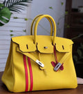 HERMÈS  LIMITED EDITION OFFICIER BIRKIN 35 SOLEIL TOGO HANDBAG