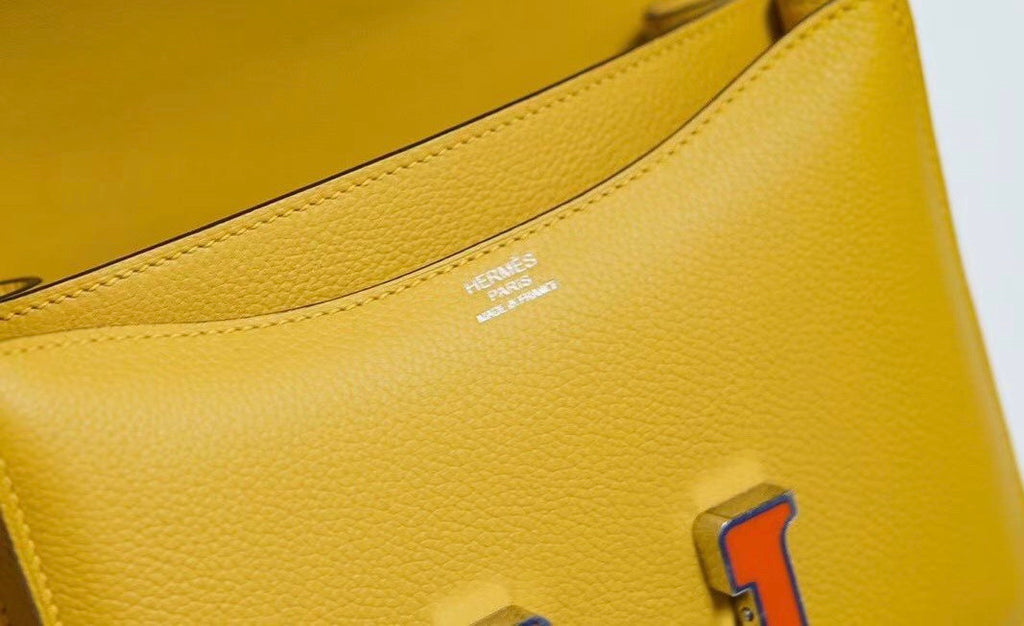 Hermes Jaune d'or Constance Epsom leather 18cm With Enamel Hardware