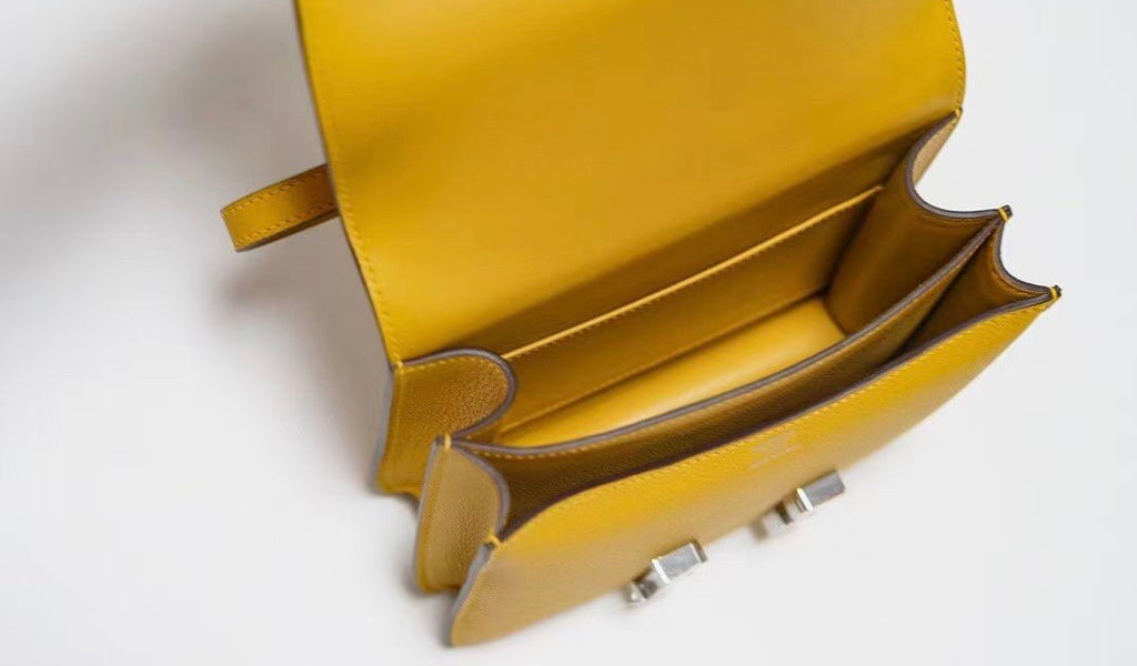 Hermes Jaune d'or Constance Epsom leather 18cm With Enamel Hardware