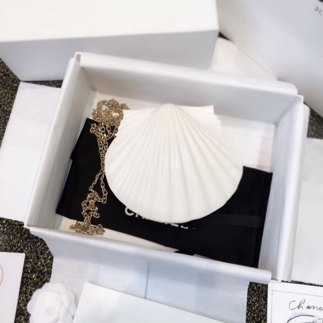 Chanel  Limited Edition shell plexiglass clutch 2019