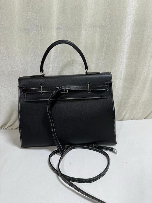 Hermes  A PARCHEMIN SWIFT LEATHER  BLACK KELLY FLAT 35 BAG