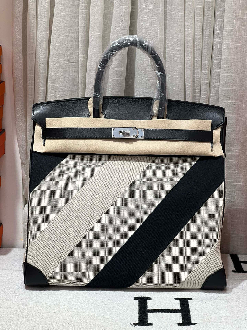 HERMÈS Limited Edition Haut à Courroies 40 HAC handbag in Black and White Evercolor leather and Toile H Canvas with Palladium hardware Hermes