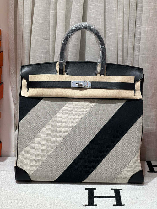 HERMÈS Limited Edition Haut à Courroies 40 HAC handbag in Black and White Evercolor leather and Toile H Canvas with Palladium hardware Hermes