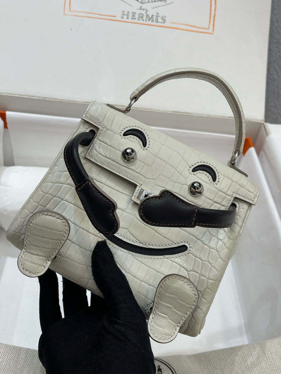 Hermes Kelly Idole (Kelly Doll) in Grey Alligator with Palladium hardware.