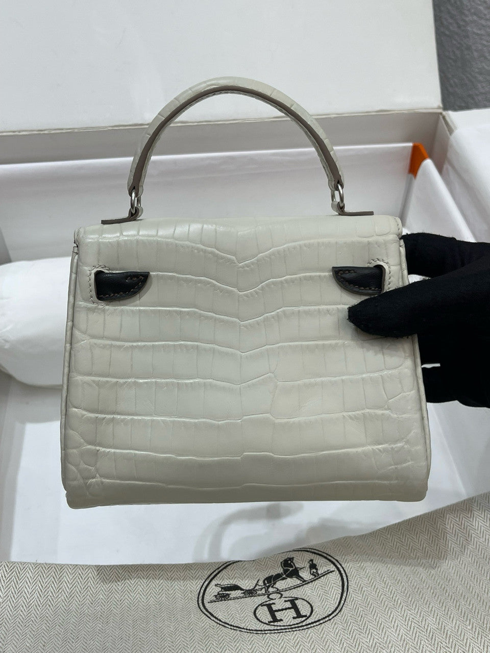 Hermes Kelly Idole (Kelly Doll) in Grey Alligator with Palladium hardware.