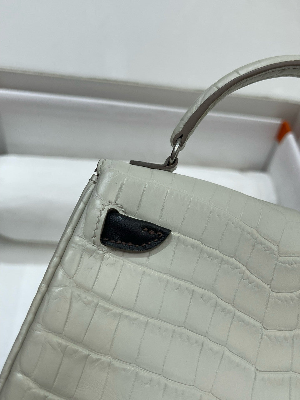 Hermes Kelly Idole (Kelly Doll) in Grey Alligator with Palladium hardware.