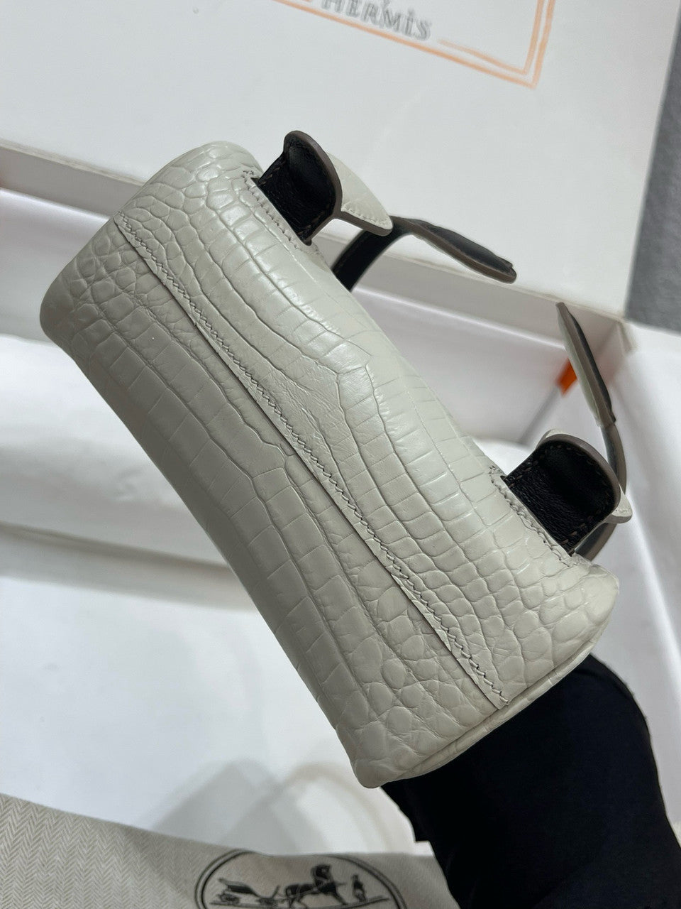 Hermes Kelly Idole (Kelly Doll) in Grey Alligator with Palladium hardware.