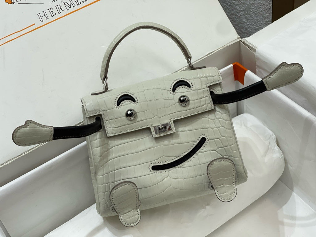 Hermes Kelly Idole (Kelly Doll) in Grey Alligator with Palladium hardware.