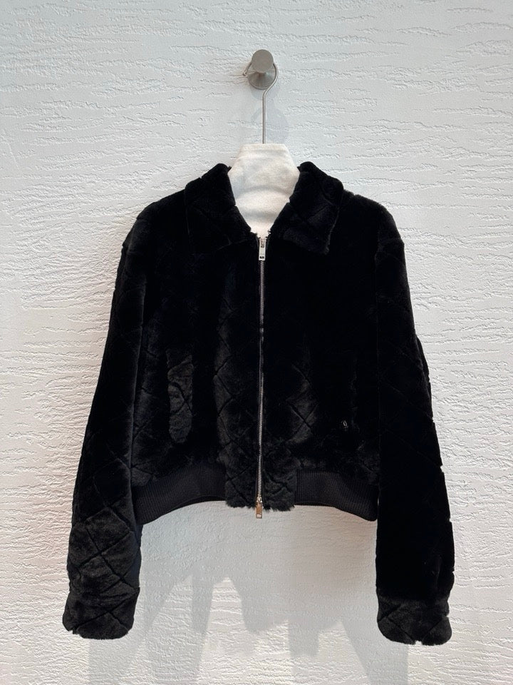 Chanel shearling bomber jacket in black — front view