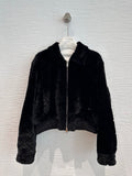 Chanel shearling bomber jacket in black — front view