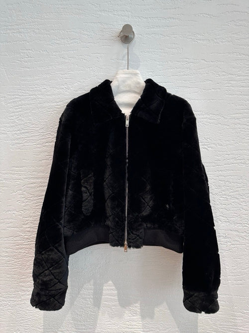 Chanel shearling bomber jacket in black — front view