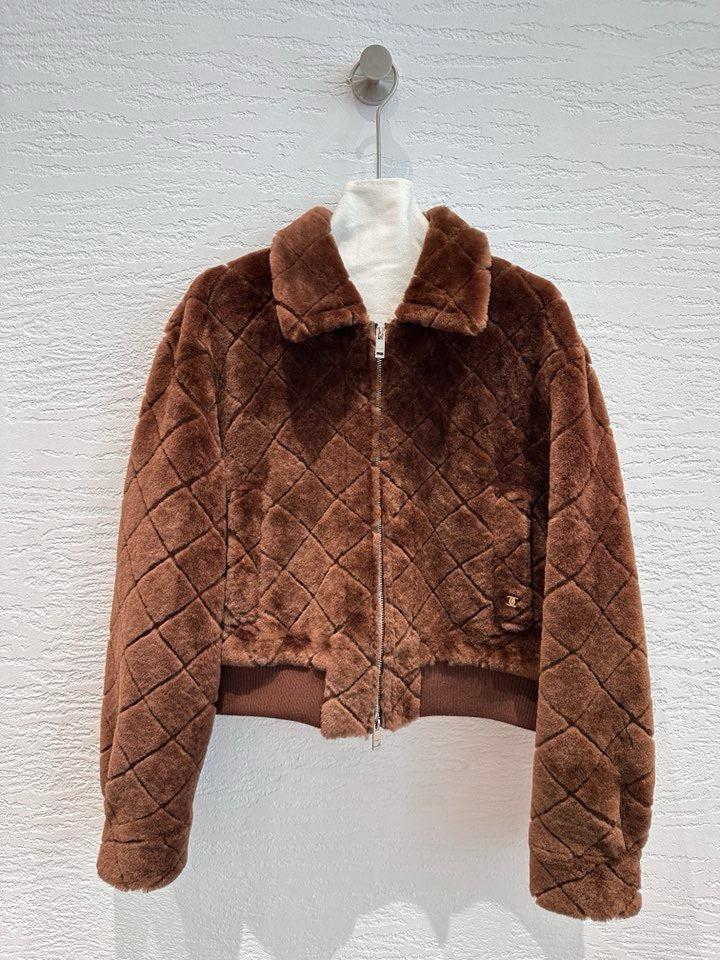 Chanel shearling bomber jacket in chocolate brown — front view