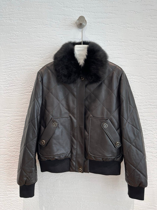 Chanel quilted leather bomber jacket in black, front view