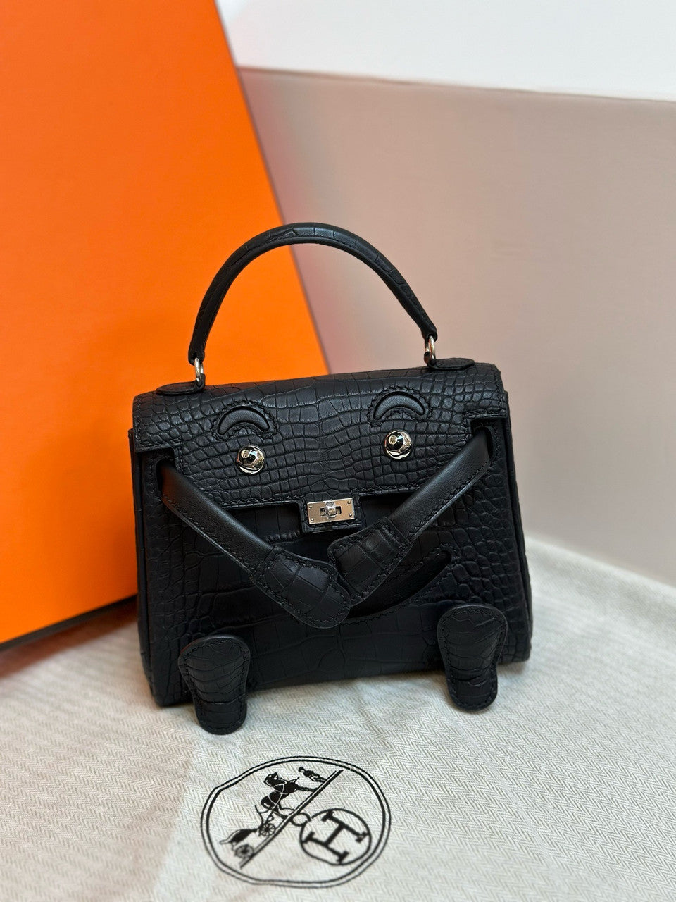 Hermes Kelly Idole (Kelly Doll) in Black Alligator with Palladium hardware. Hermes
