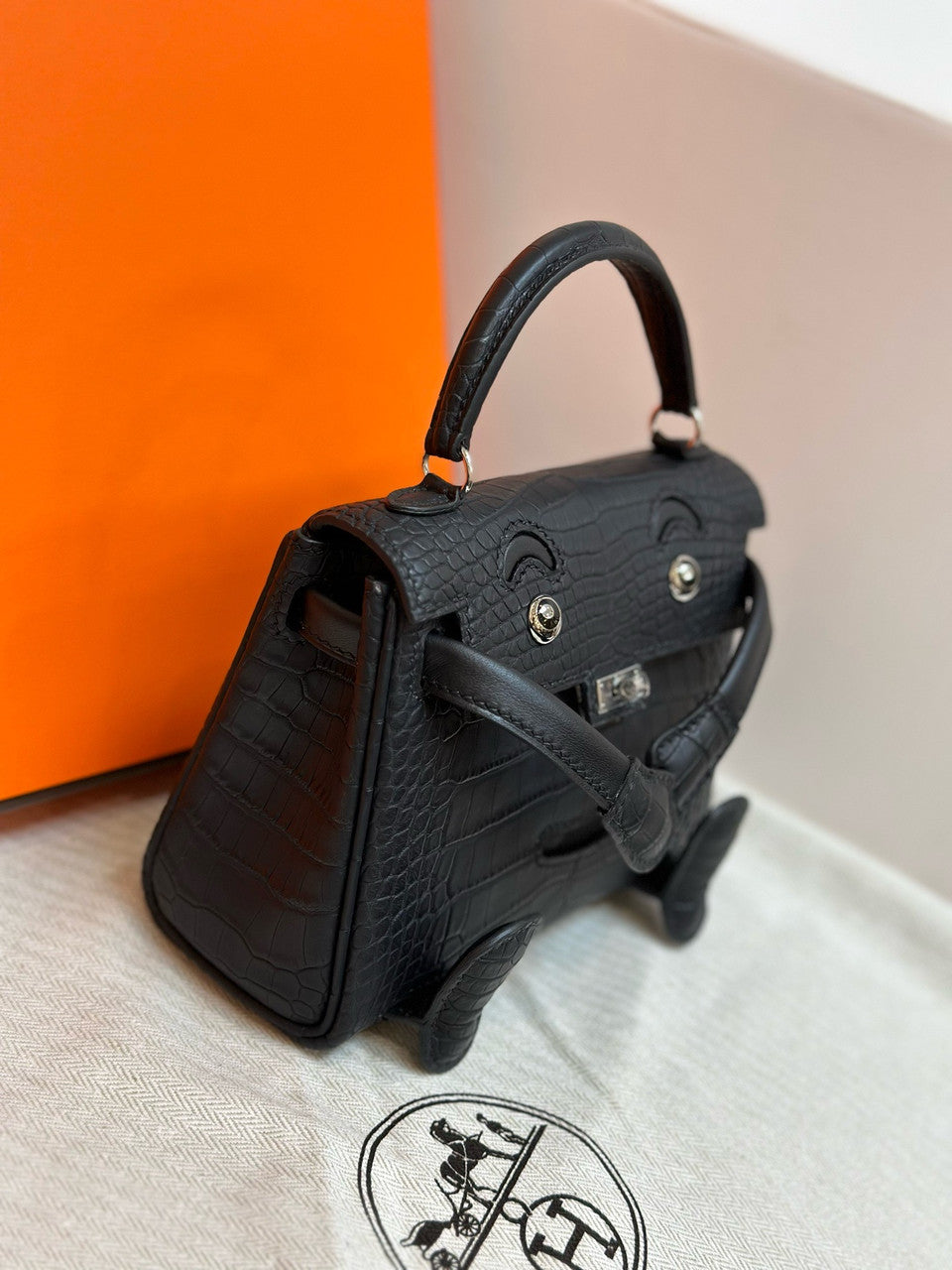 Hermes Kelly Idole (Kelly Doll) in Black Alligator with Palladium hardware. Hermes