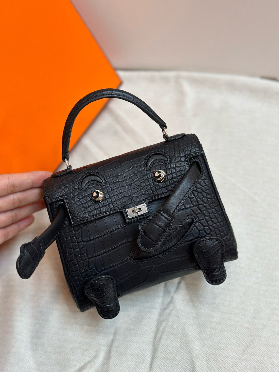 Hermes Kelly Idole (Kelly Doll) in Black Alligator with Palladium hardware. Hermes