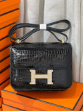 HERMES SHINY BLACK POROSUS CROCODILE MINI CONSTANCE 18 WITH GOLD & DIAMOND HARDWARE