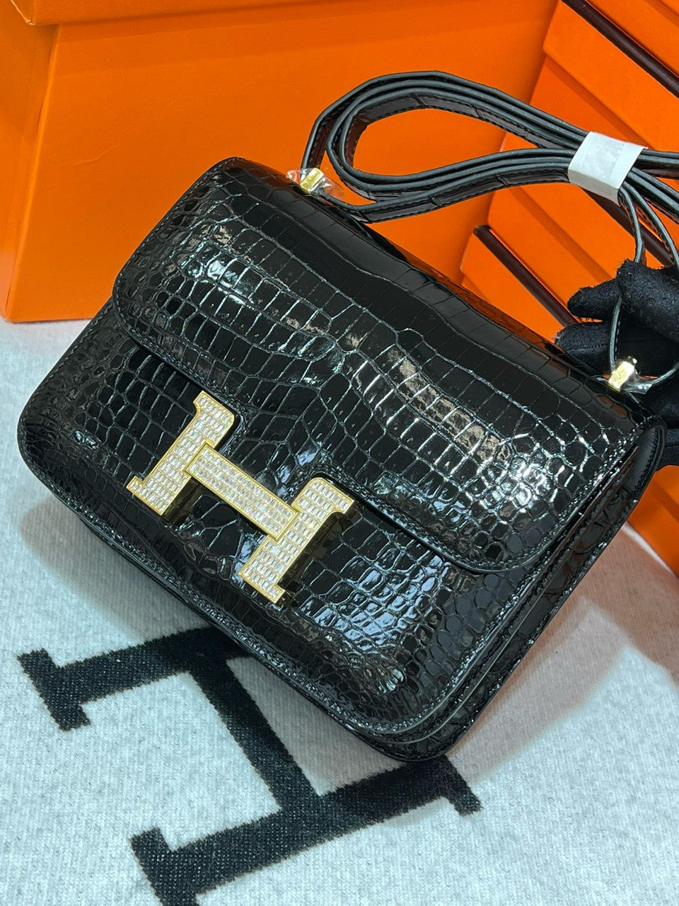 HERMES SHINY BLACK POROSUS CROCODILE MINI CONSTANCE 18 WITH GOLD & DIAMOND HARDWARE