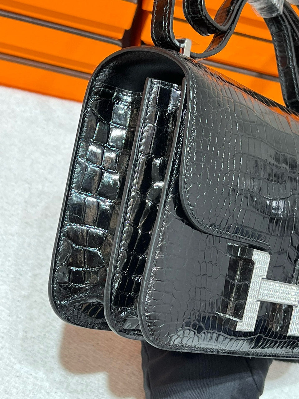 HERMES SHINY BLACK POROSUS CROCODILE MINI CONSTANCE 18 WITH 18K WHITE GOLD & DIAMOND HARDWARE
