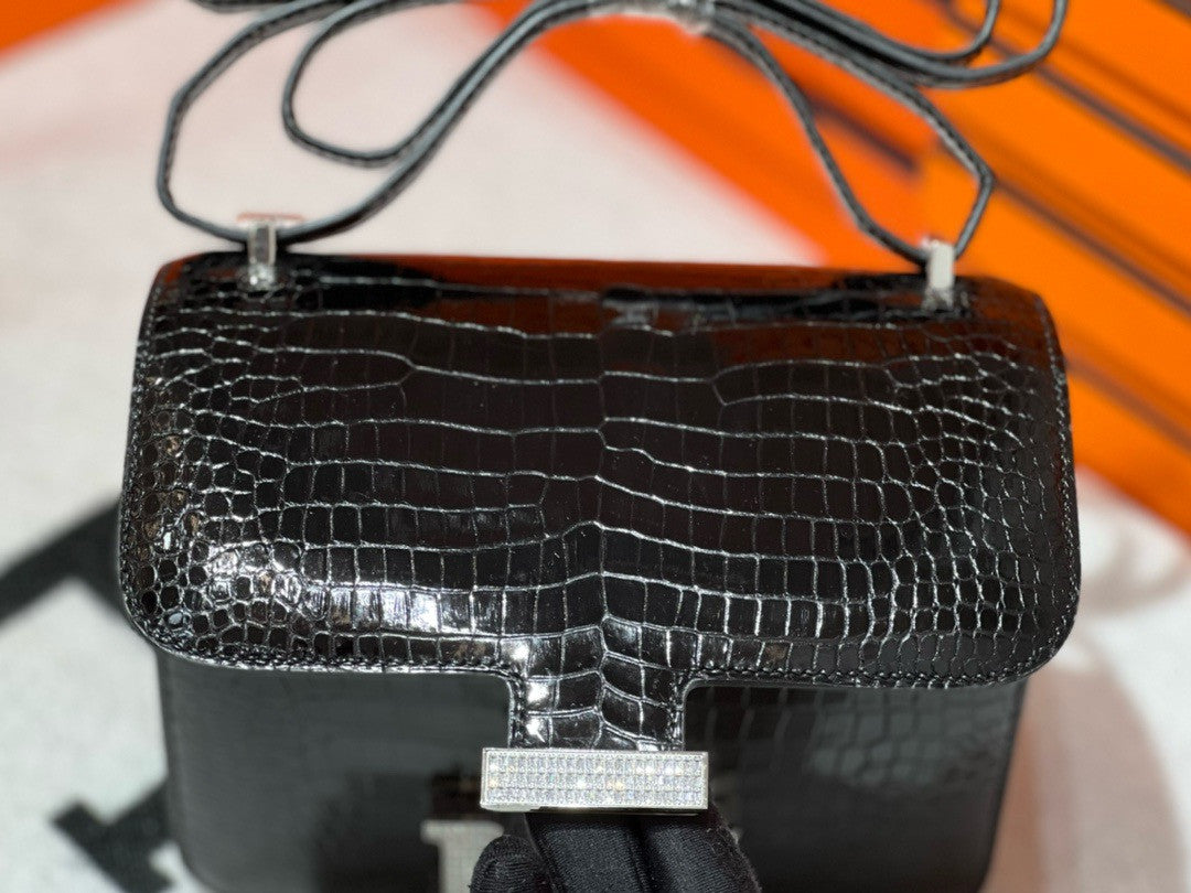 HERMES SHINY BLACK POROSUS CROCODILE MINI CONSTANCE 18 WITH 18K WHITE GOLD & DIAMOND HARDWARE