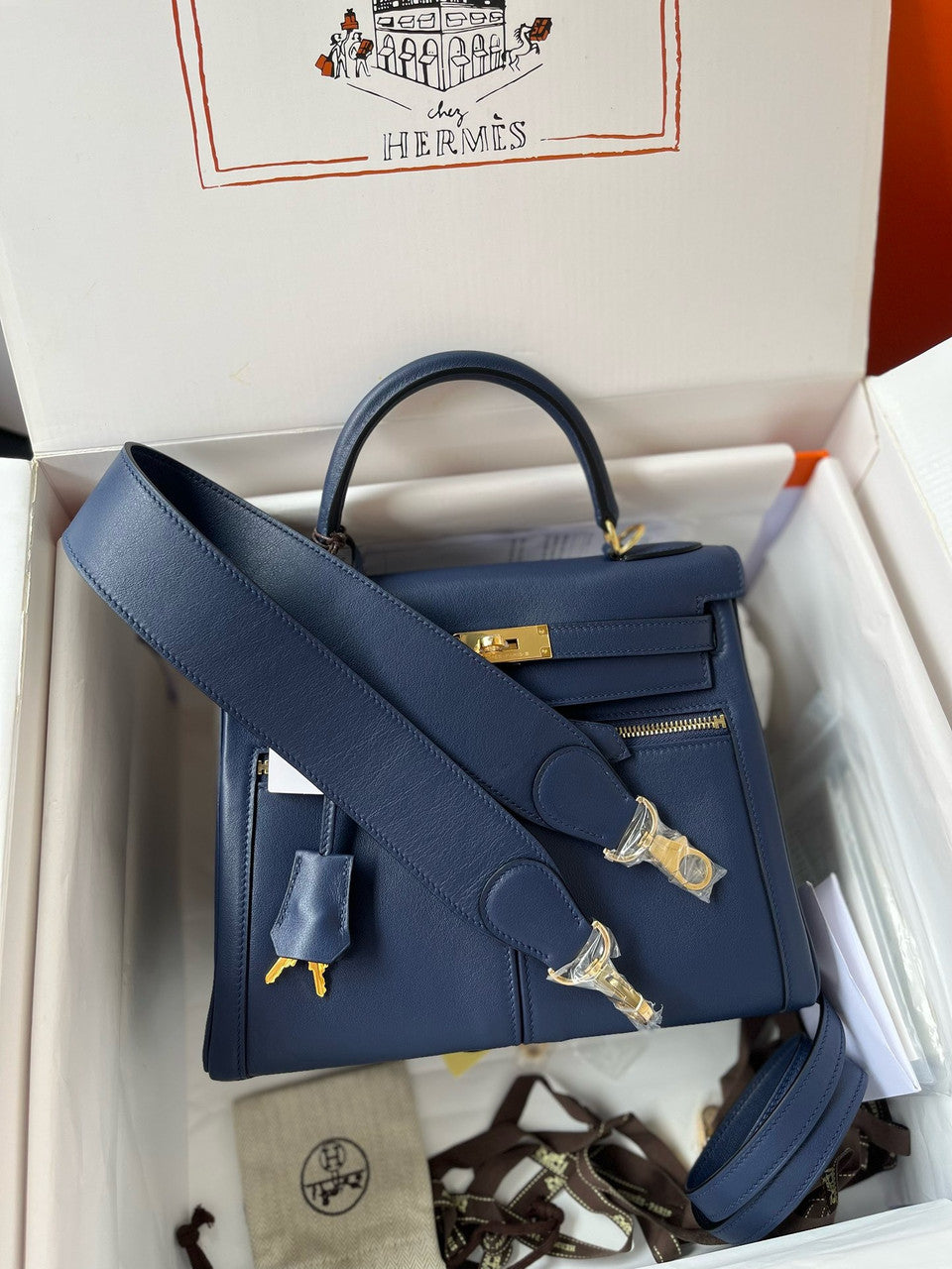 Hermes LIMITED EDITION Blue Sapphire SWIFT LEATHER LAKIS KELLY 28 WITH GOLD HARDWARE