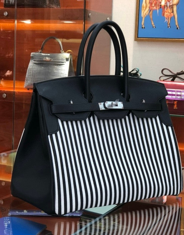 HERMES A LIMITED EDITION BLACK SWIFT LEATHER & TOILE RIGA BIRKIN 35 WITH PALLADIUM HARWARE