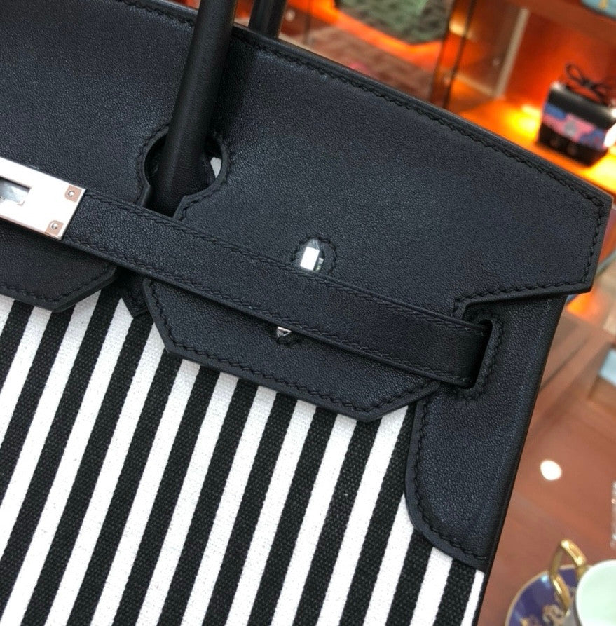 HERMES A LIMITED EDITION BLACK SWIFT LEATHER & TOILE RIGA BIRKIN 35 WITH PALLADIUM HARWARE