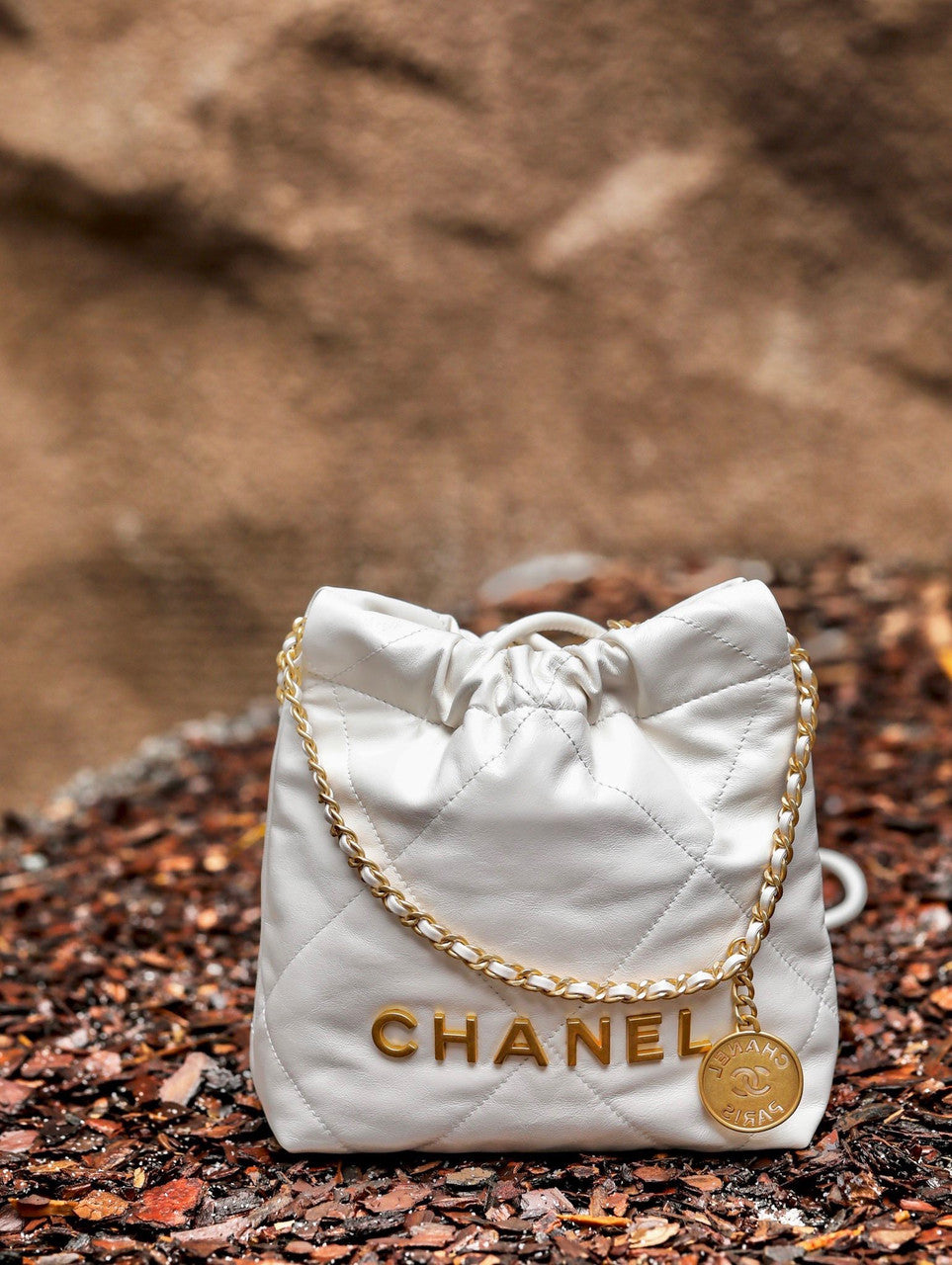 CHANEL 22 MINI HANDBAG GOLD LOGO SS2023 WHITE