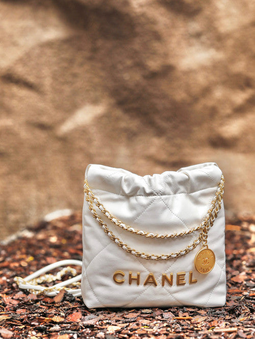 CHANEL 22 MINI HANDBAG GOLD LOGO SS2023 WHITE